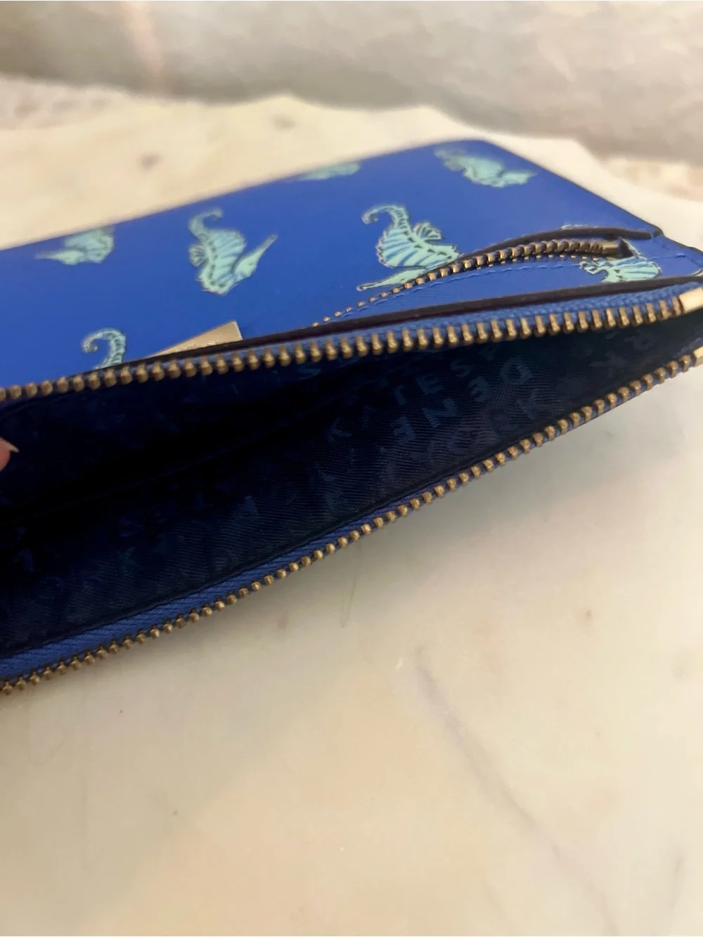 kate spade cobalt blue seahorse wristlet clutch